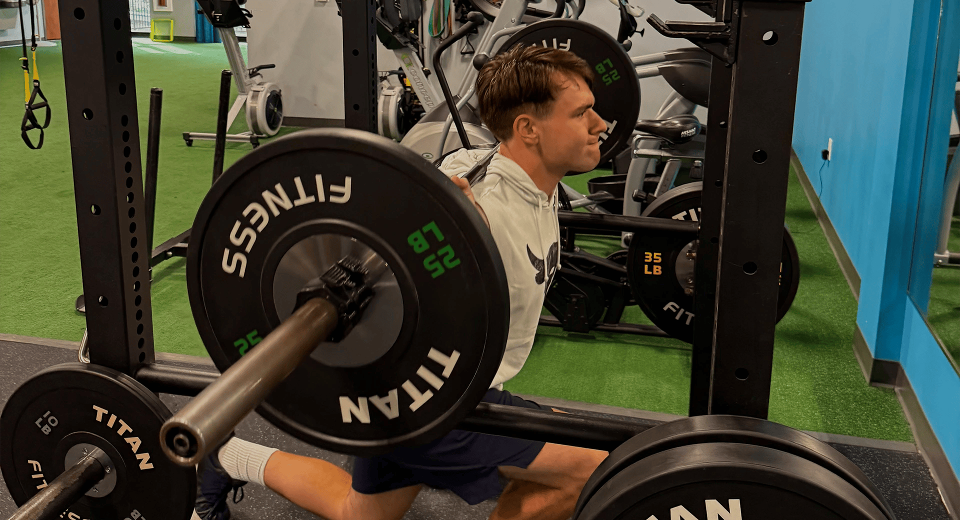 teen lifting weights at Athletic Performance Development